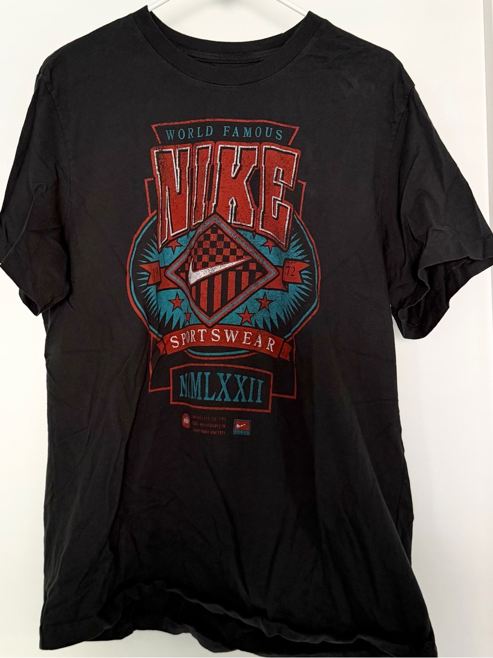 Nike Black Short Sleeve Graphic T-Shirt with Red and Teal Logo